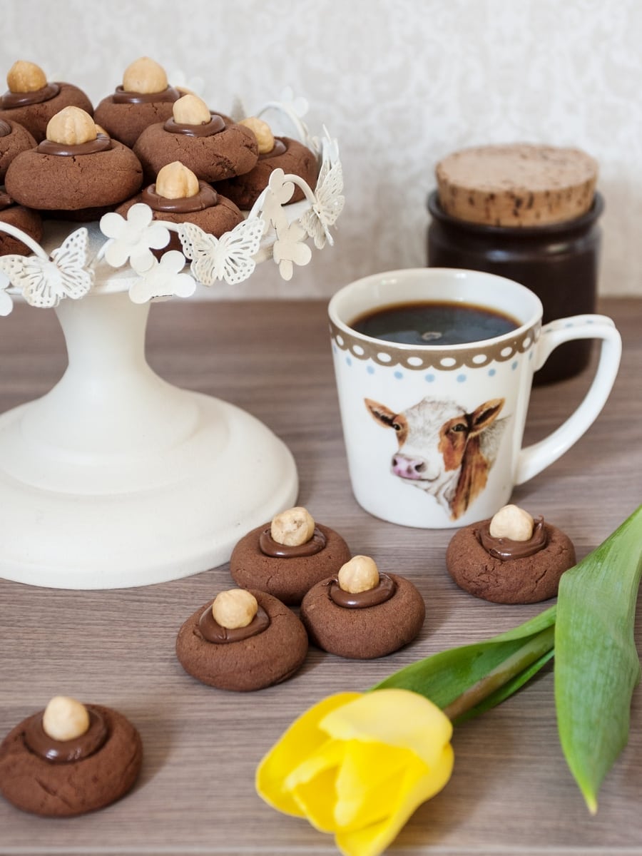 Nutellotti: Italian nutella thumbprint cookies topped with a whole hazelnut and served with coffee.