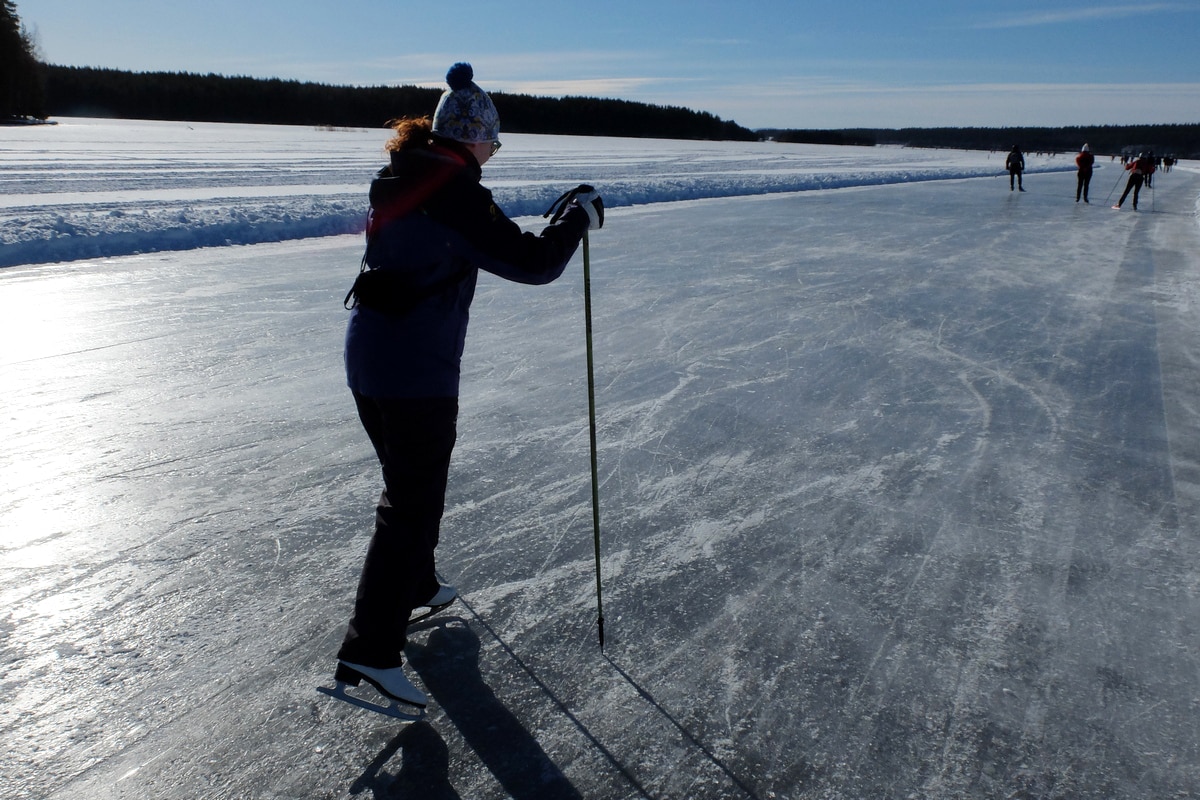 Ice skating on frozen lake Runn