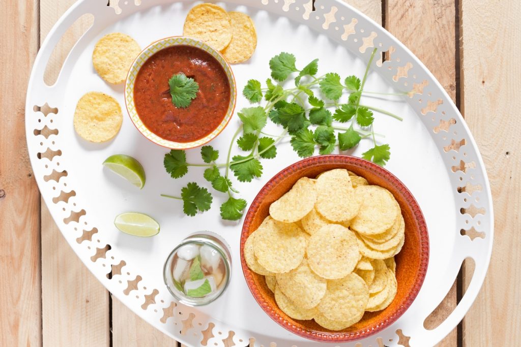 A blended salsa infused with garlic is the ultimate dip for your nacho chips.