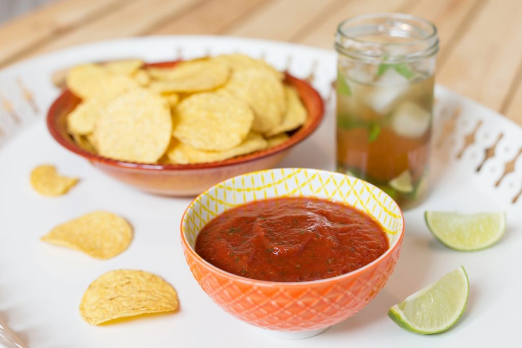 A blended salsa infused with garlic is the ultimate dip for your nacho chips.