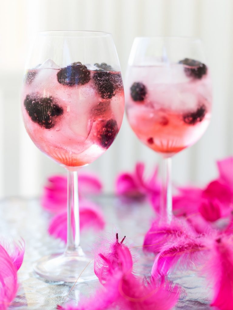 Blackberry gin and tonic with pink tonic water