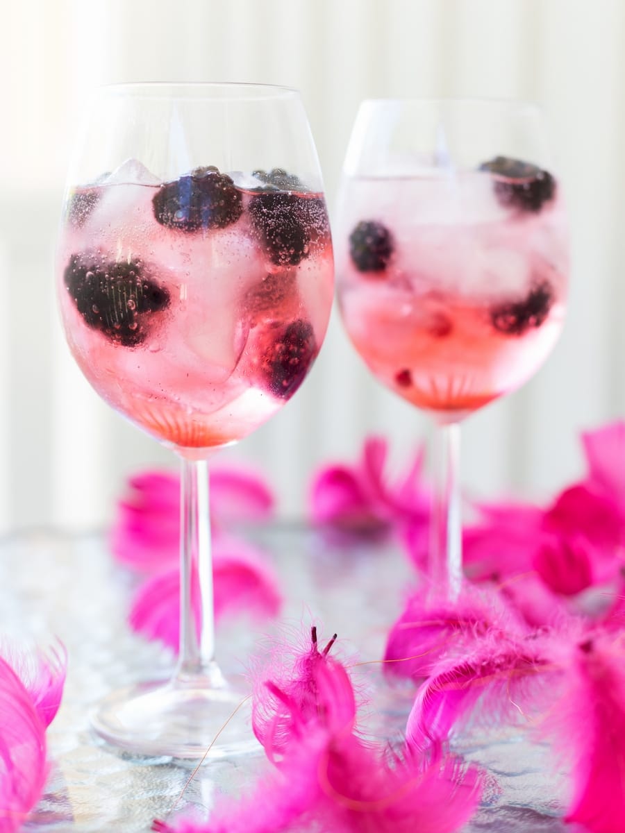 Blackberry gin and tonic with pink tonic water