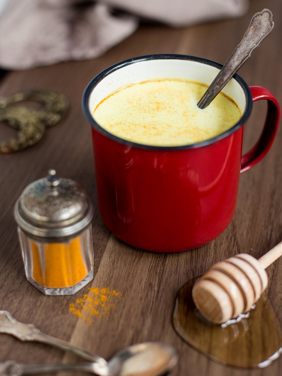 Hot milk with honey, rum and turmeric