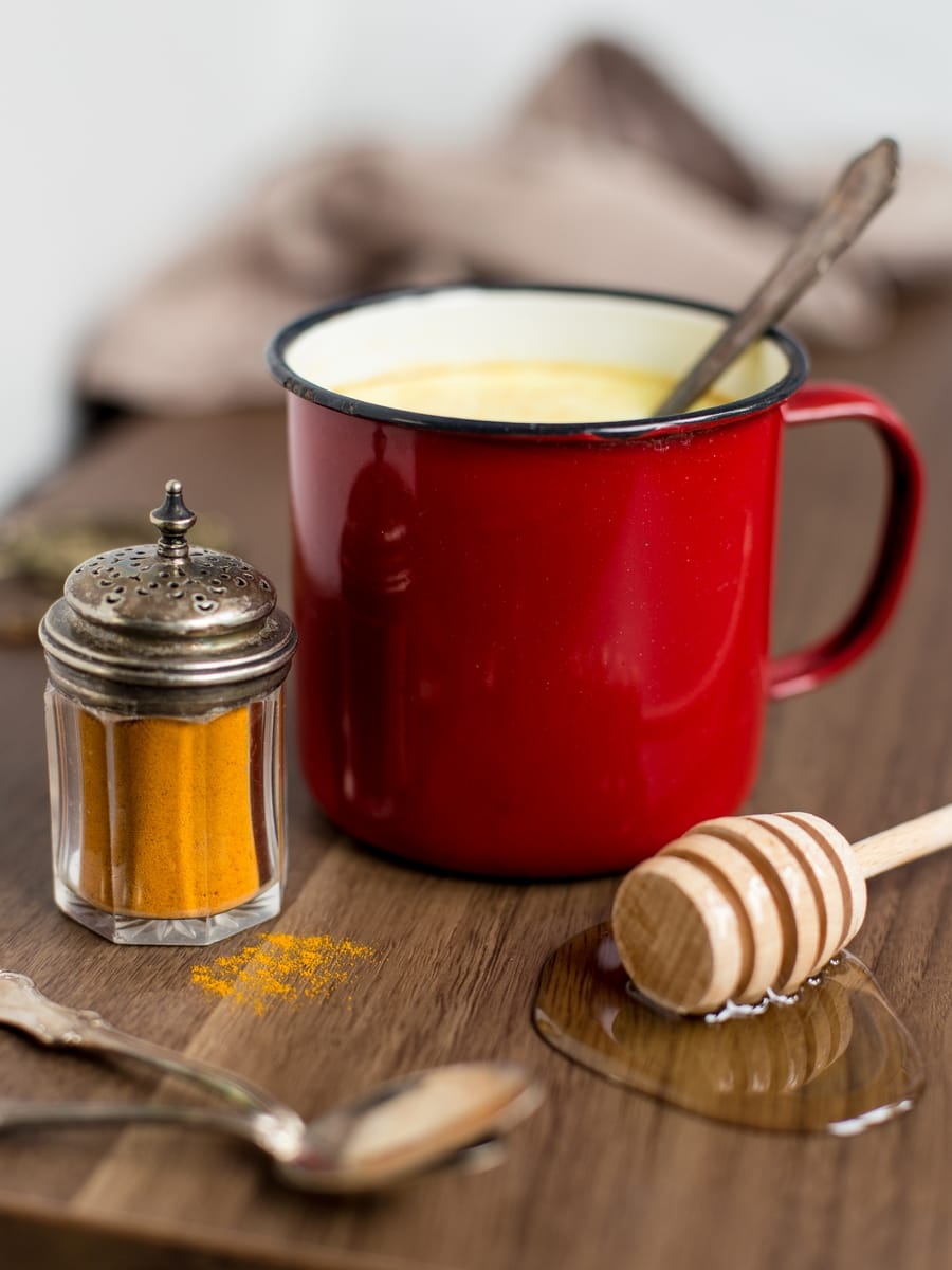 Hot honey rum milk with turmeric powder. 