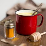 Hot honey rum latte with turmeric powder.