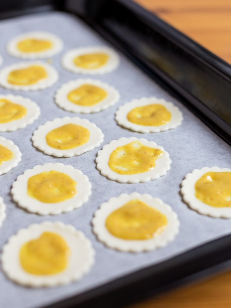 Puff pastry topped with mustard.