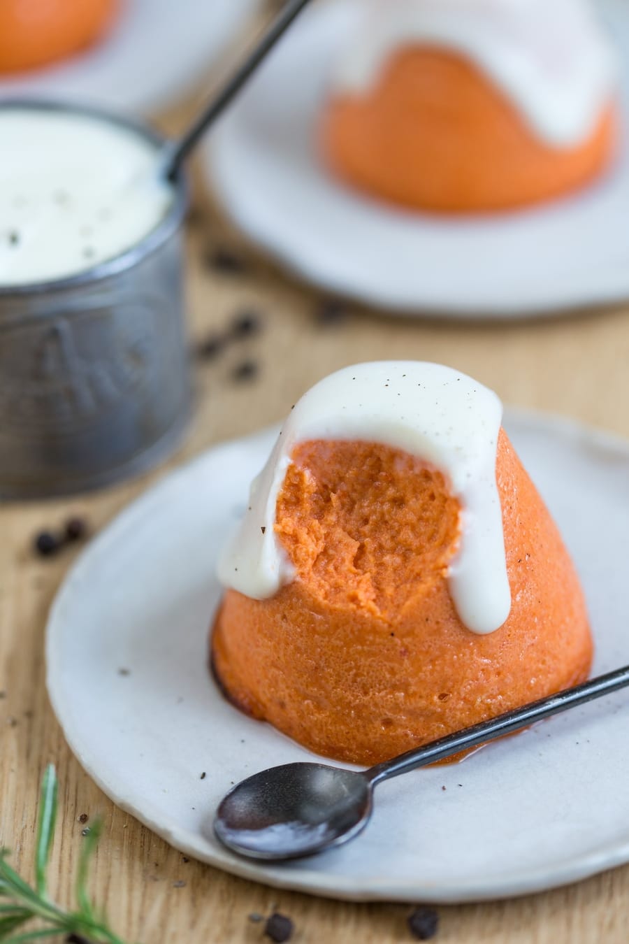 Roasted pepper flan with pecorino sauce that is being eaten.