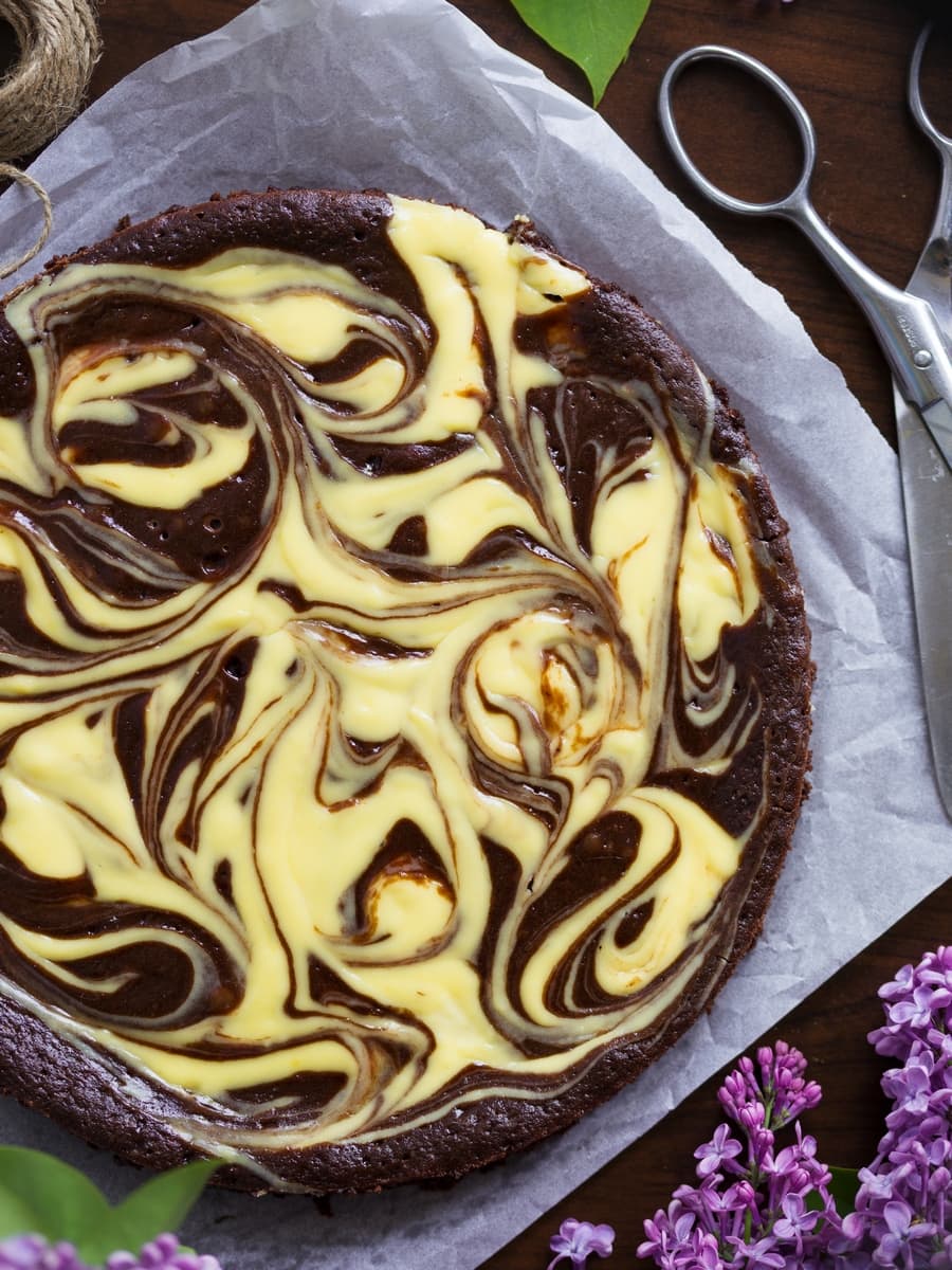 Cheesecake kladdkaka seen from above. Chocolate cake with a cheesecake swirl on top.