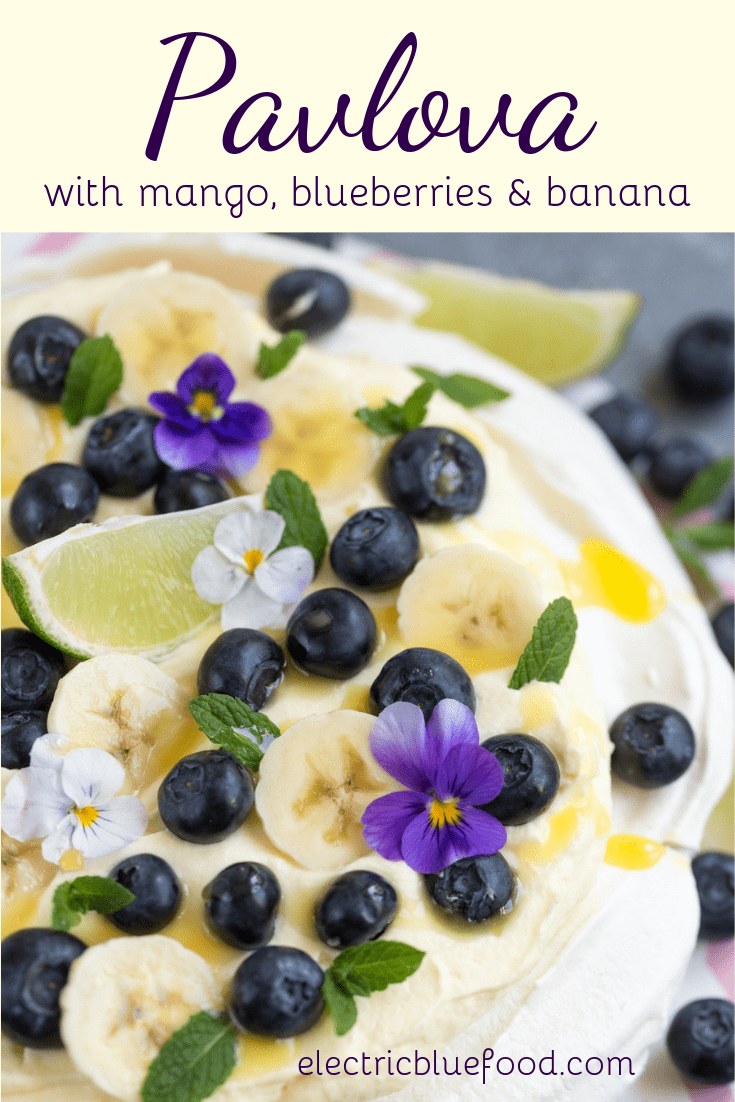 Pavlova with mango, blueberries and banana. A blue and yellow topping for this Australian cake.