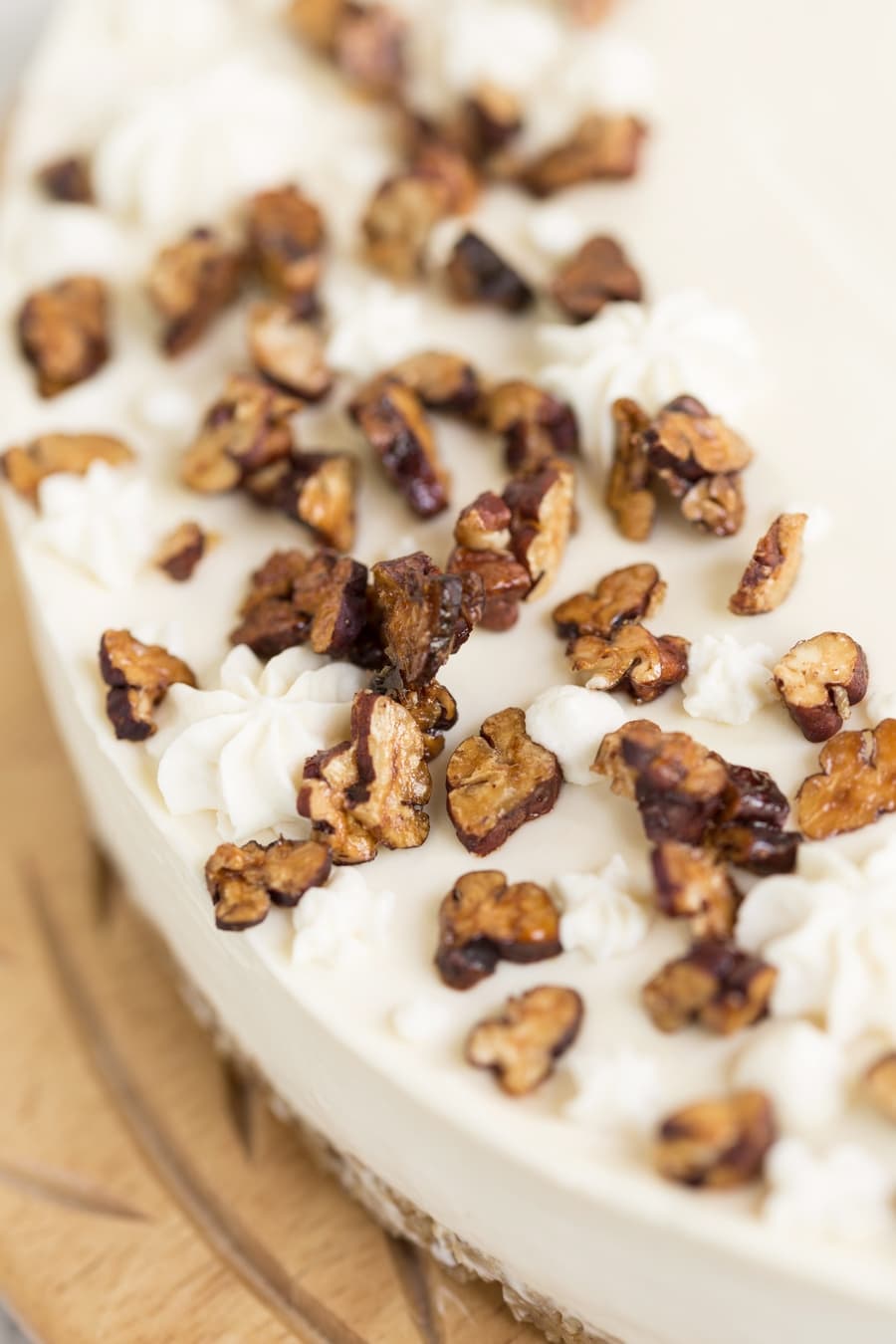 Macro of roasted pecans on maple no-bake cheesecake.