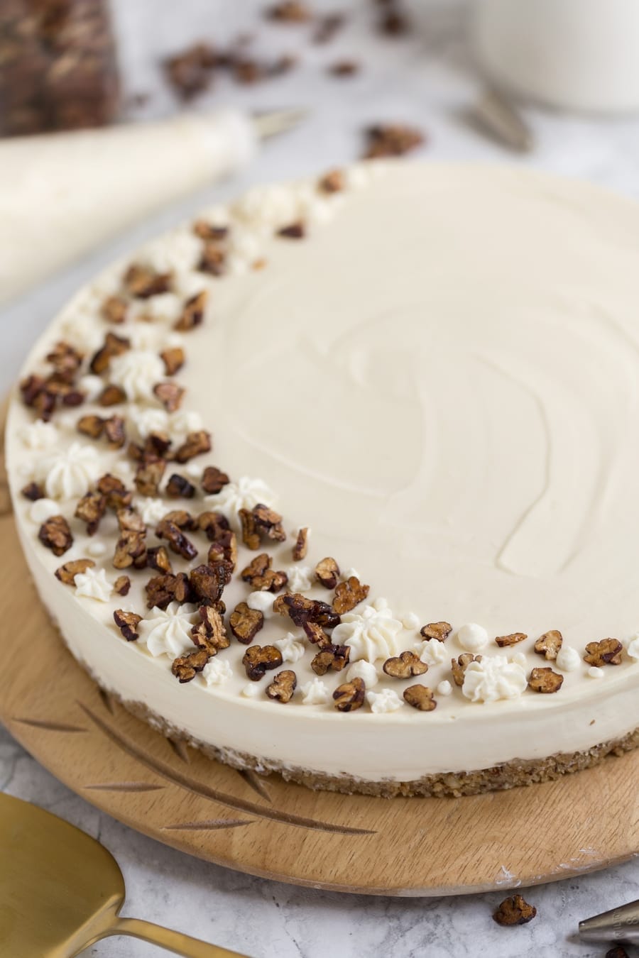 No-bake maple syrup cheesecake on wooden plate.