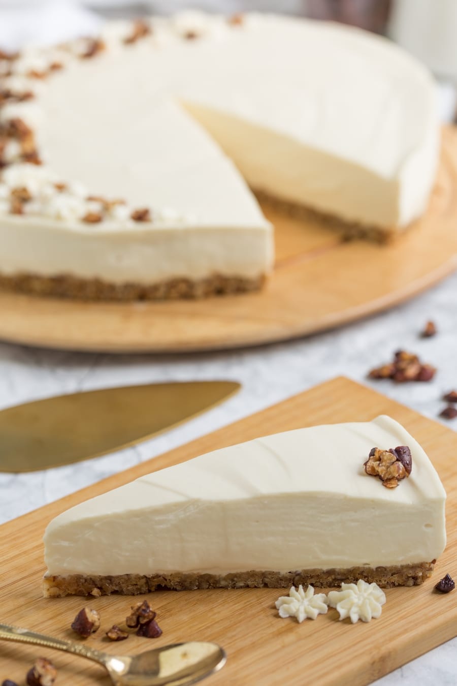 Cheesecake slice with candied pecans.