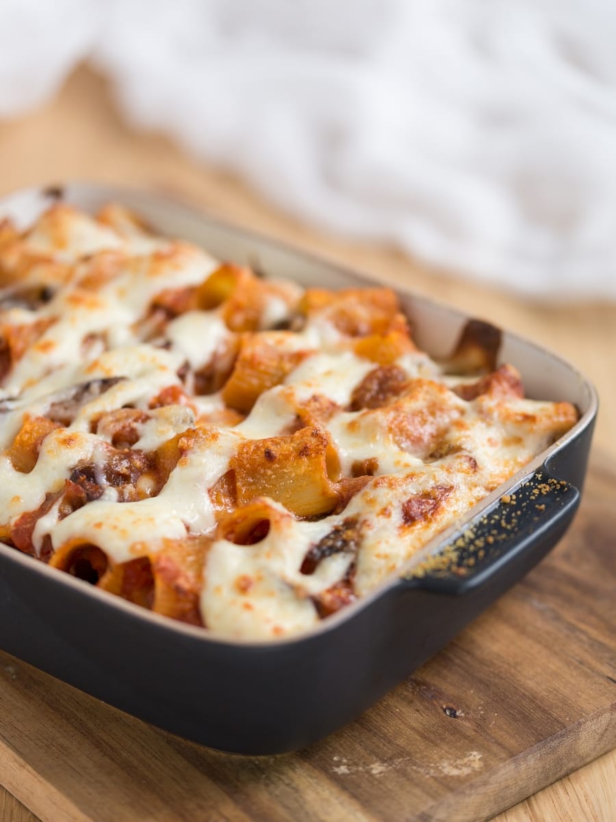 Baked pasta casserole sprinkled with parmesan.