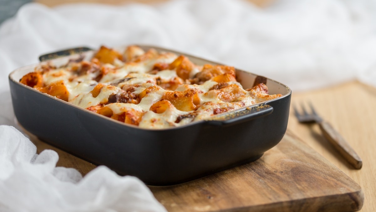Black casserole dish filled with baked patsa recipe.