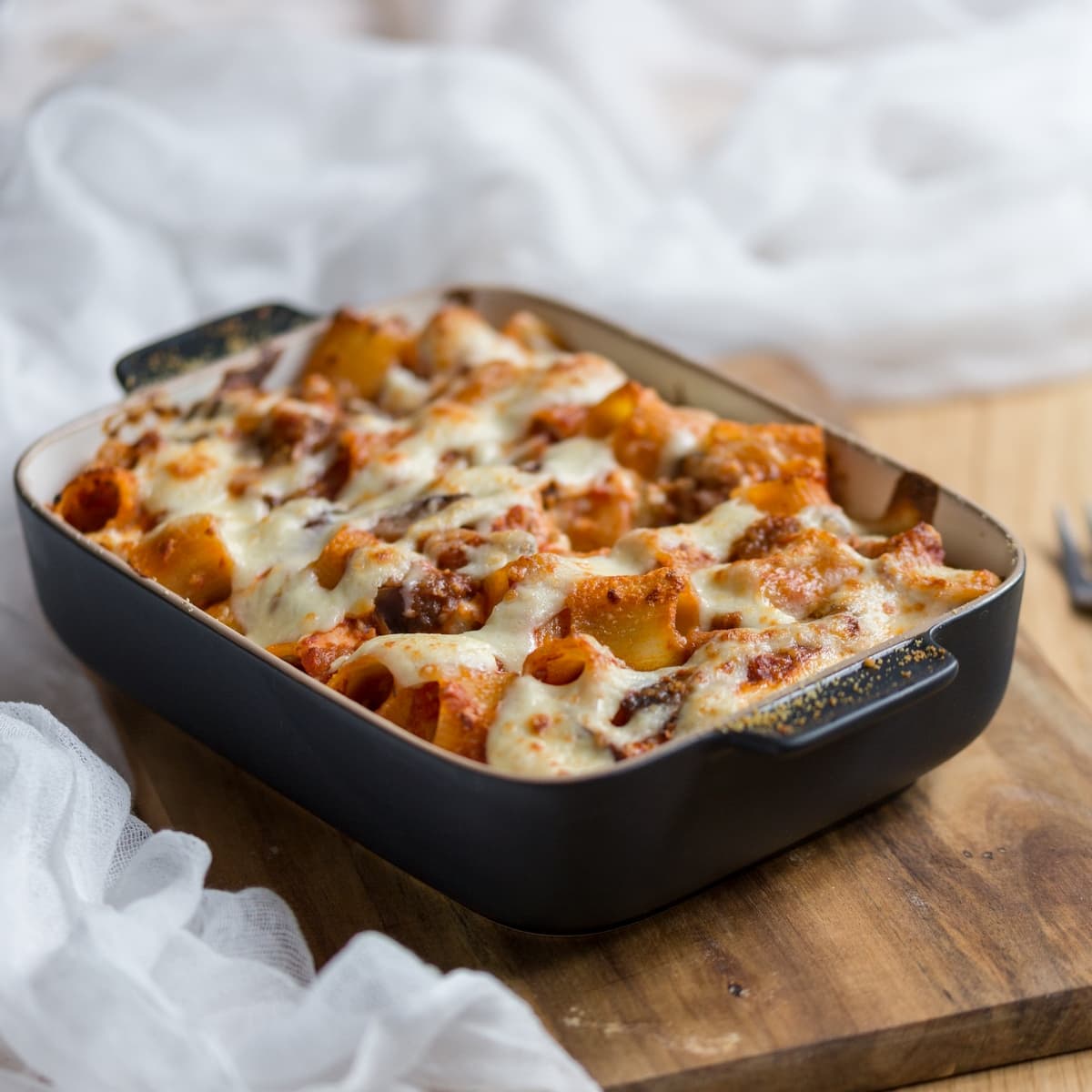 Eggplant pasta bake served in casserole dish.