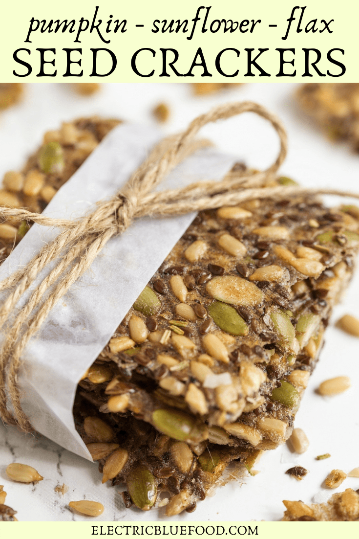 Homemade multi seed crackers with pumpkin, sunflower and flax seeds. Flavoured with dried rosemary and salt flakes.