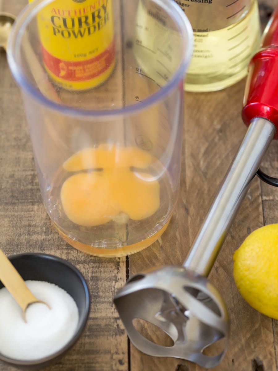 Ingredients needed to make homemade curry mayonnaise.