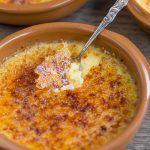Lime crème brûlée cracked with a silver spoon.