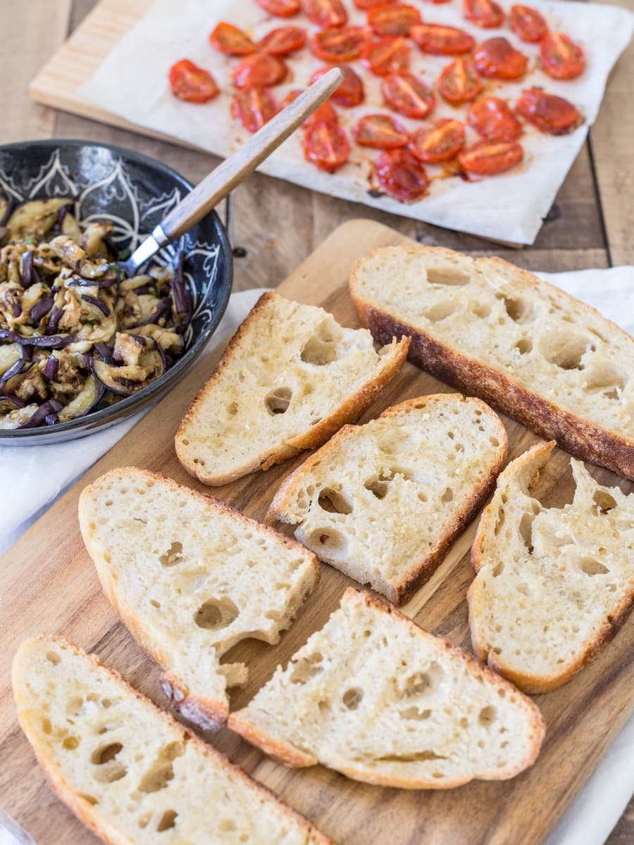 Toasted sourdough bread, grilled eggplants and roasted cherry tomatoes on the side.