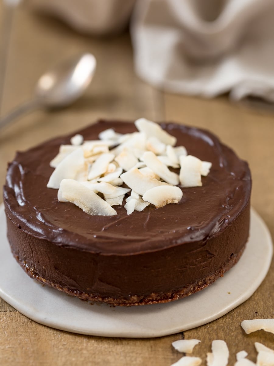 Small vegan raw chocolate cake with avocado and date syrup.