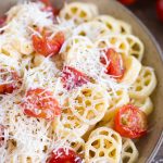 Oven-roasted cherry tomato pasta closeup.