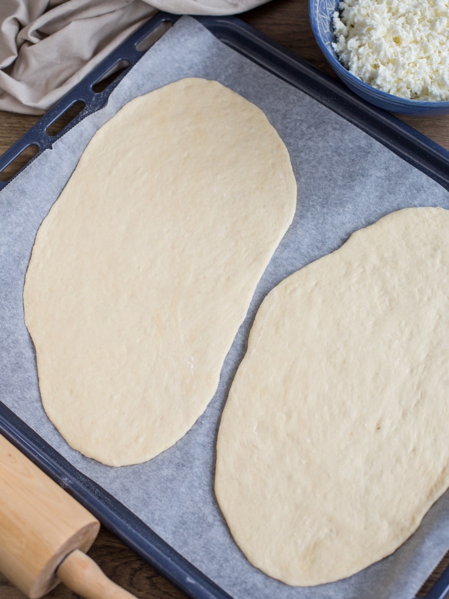 Rolled out dough to make homemade khachapuri.