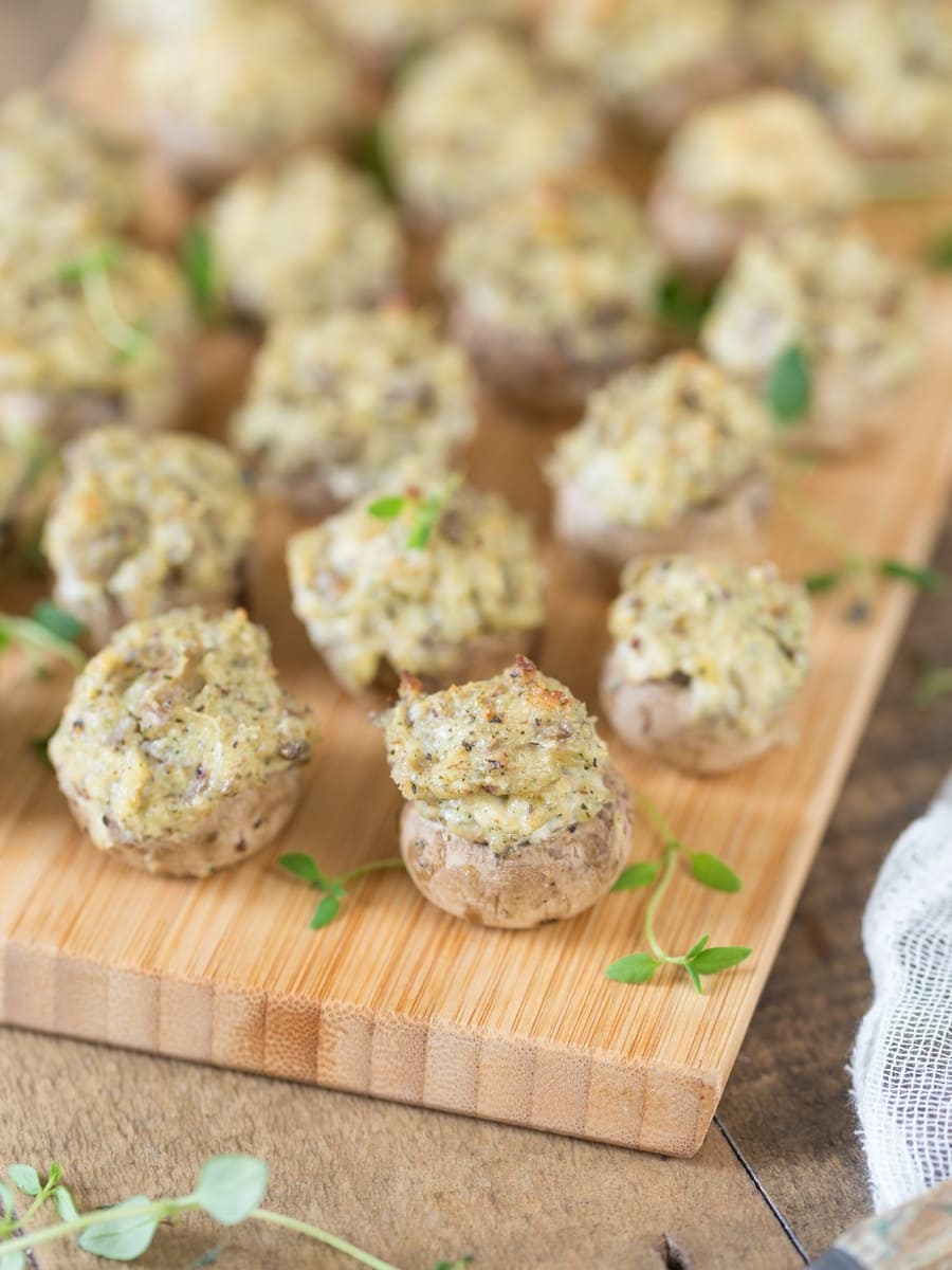 Closeup of cream cheese and hazelnut stuffed baked mushrooms.