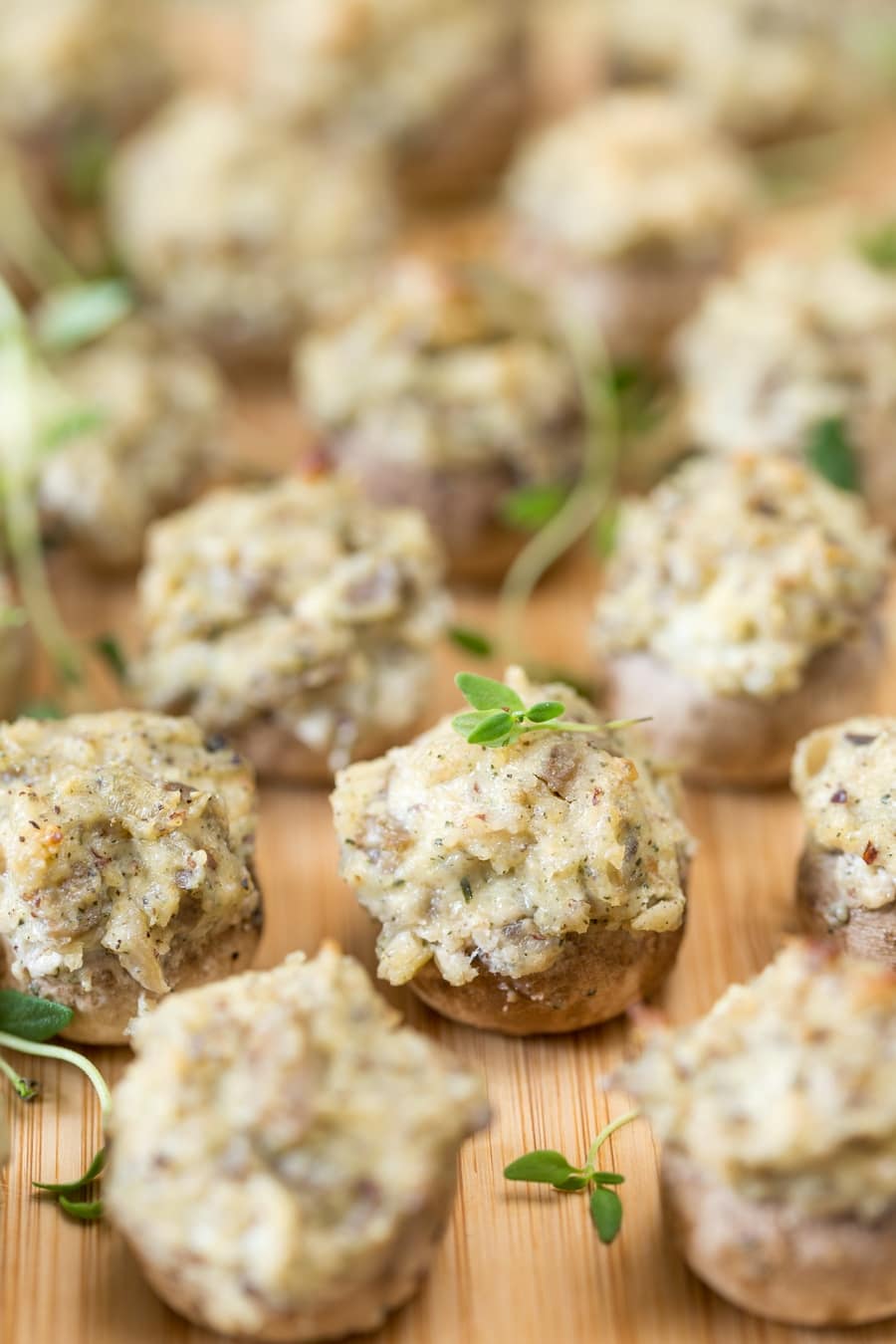 Closeup of cream cheese and hazelnut stuffed mushrooms.