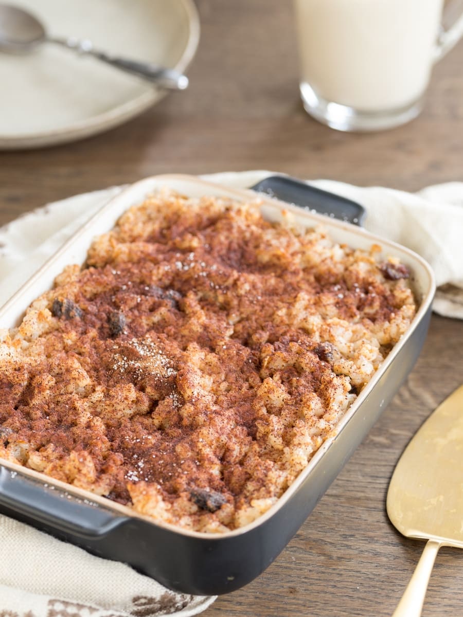 Apple rice pudding casserole sprinkled with ground cinnamon and sugar.