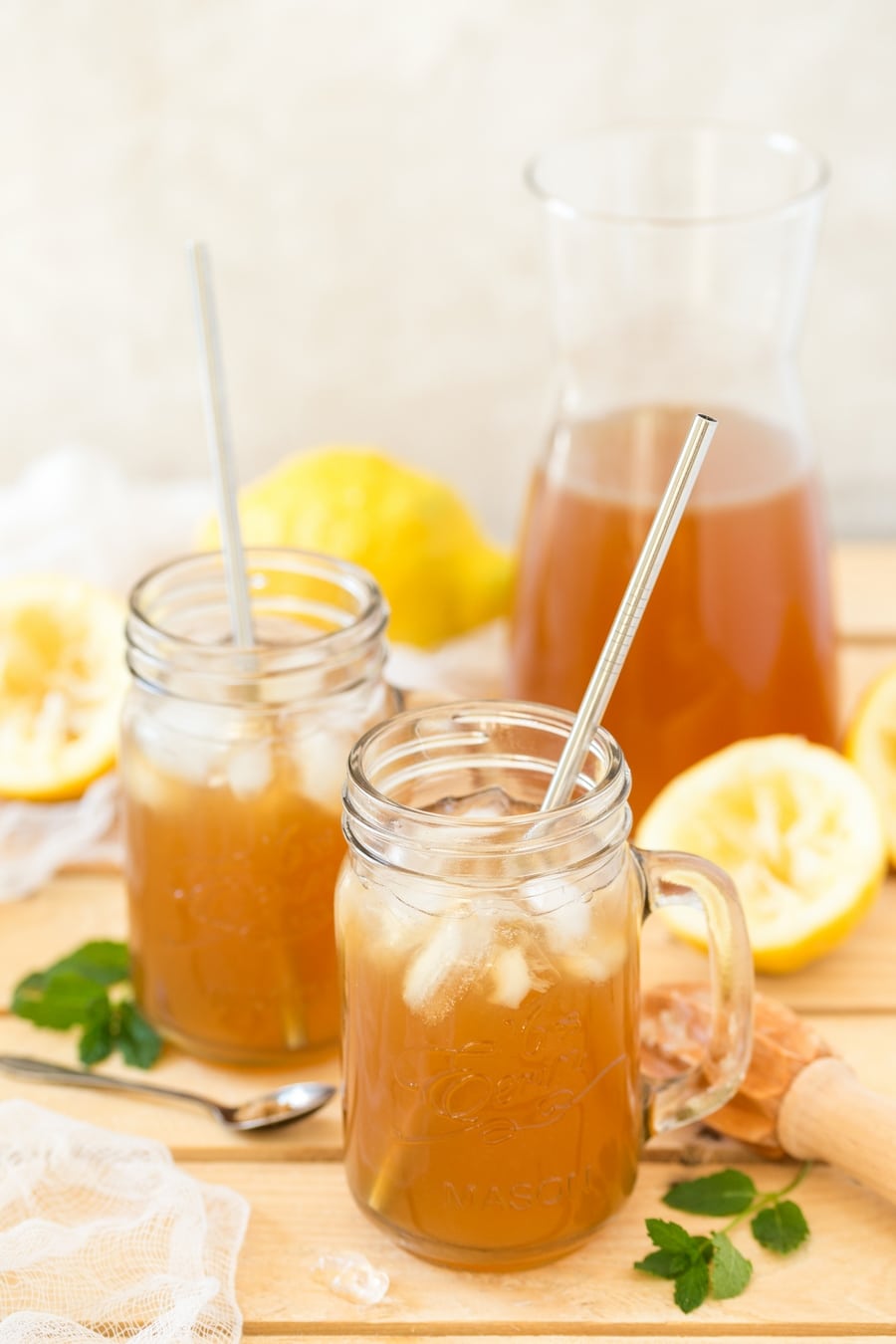 Brown lemonade in mason jars with ice.
