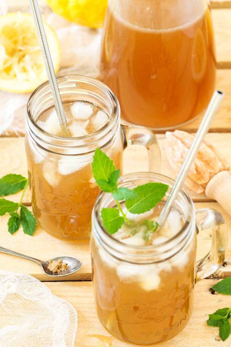 Borwn lemonade with fresh mint leaves.
