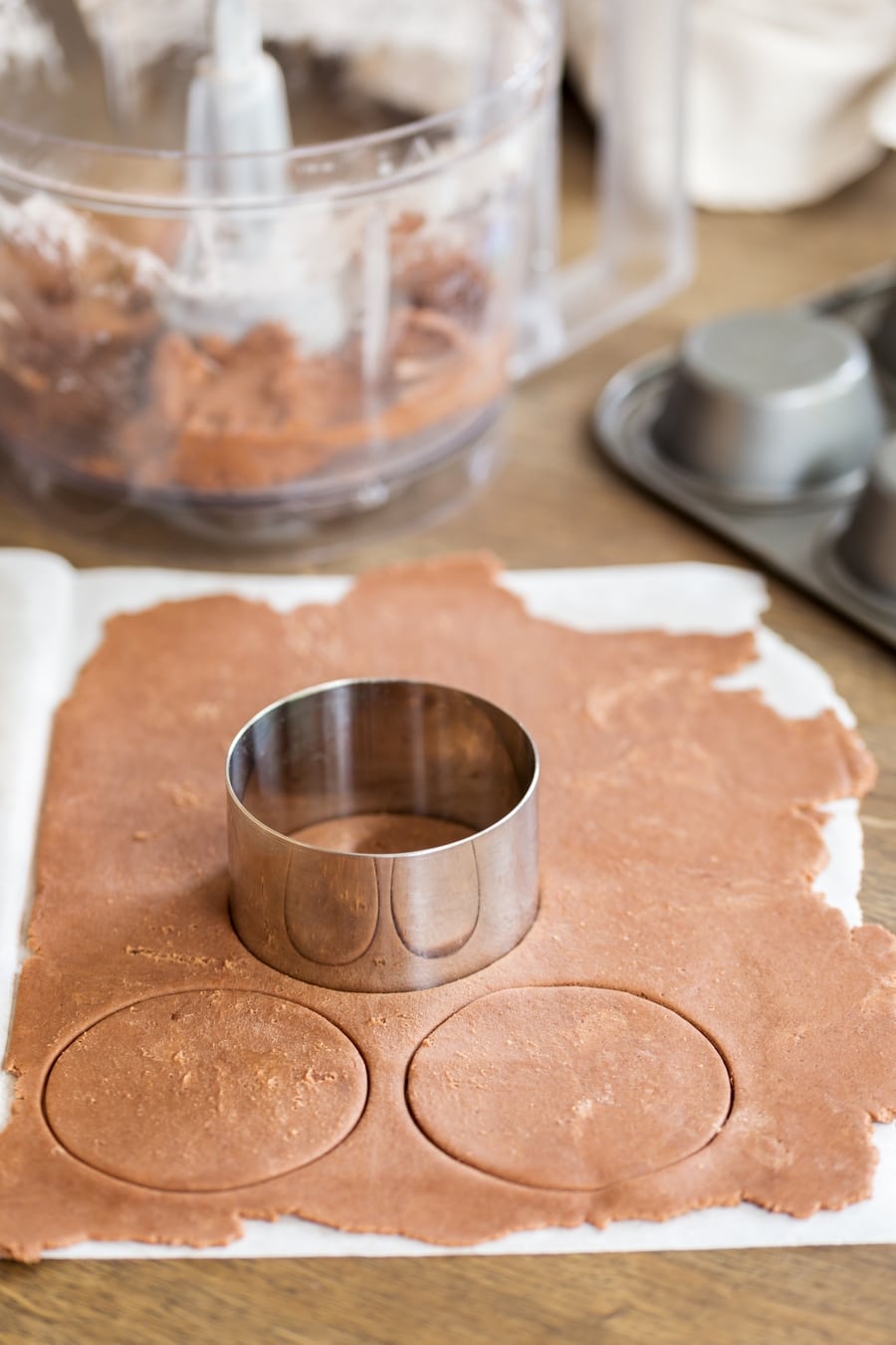 Cutting out shortcrust pastry circles.