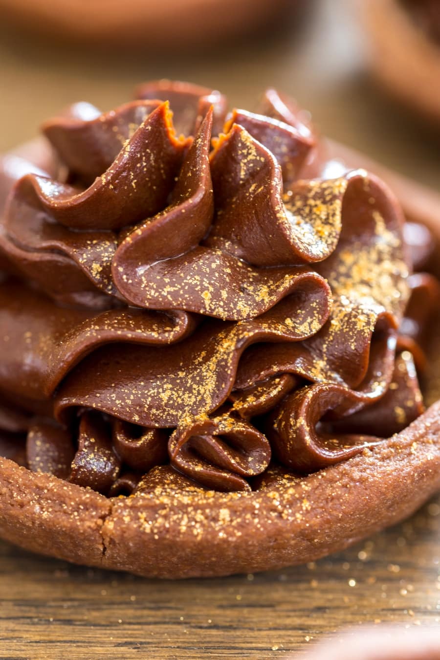 Chocolate mascarpone cream in a small shortcrust shell, decorated with edible glitter.