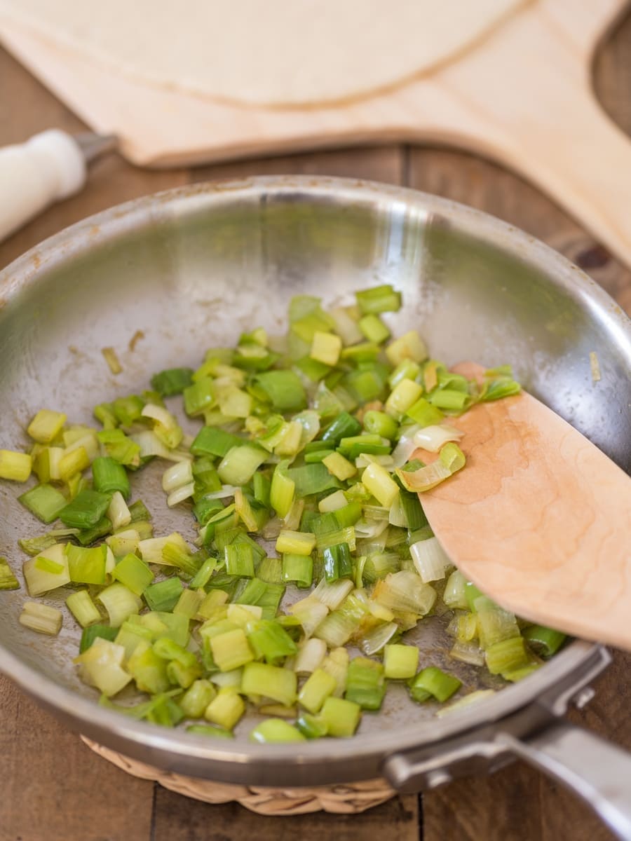 Sautéed leek in a frying pan.