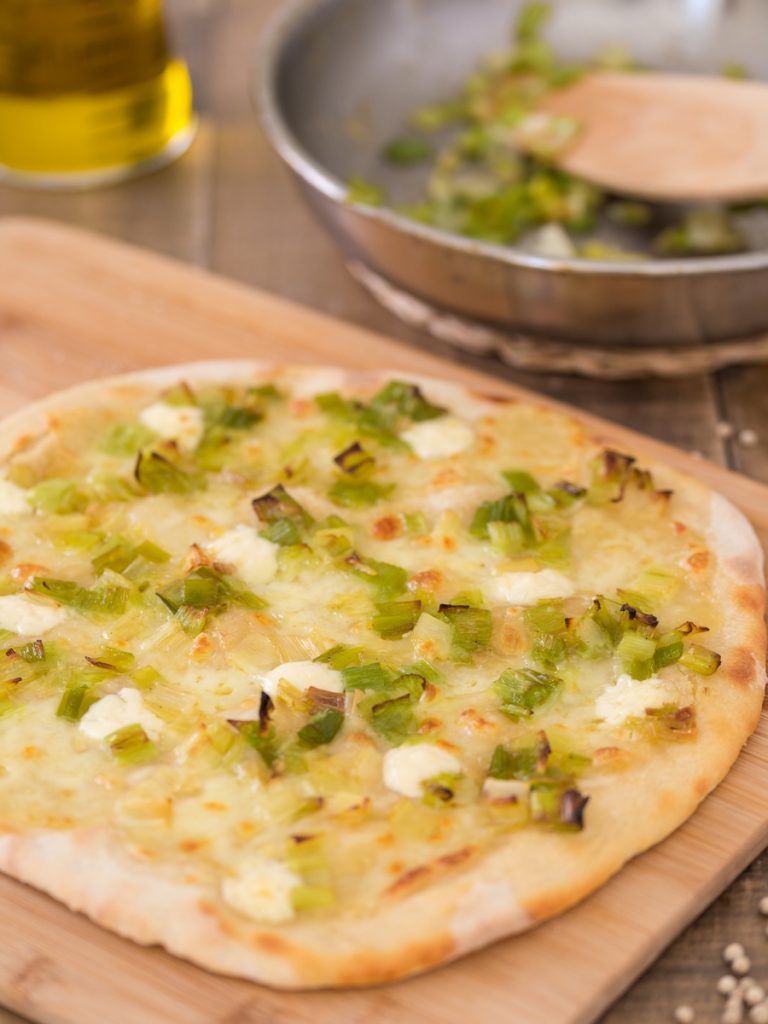 Pizza with mascarpone and sauteed leeks.