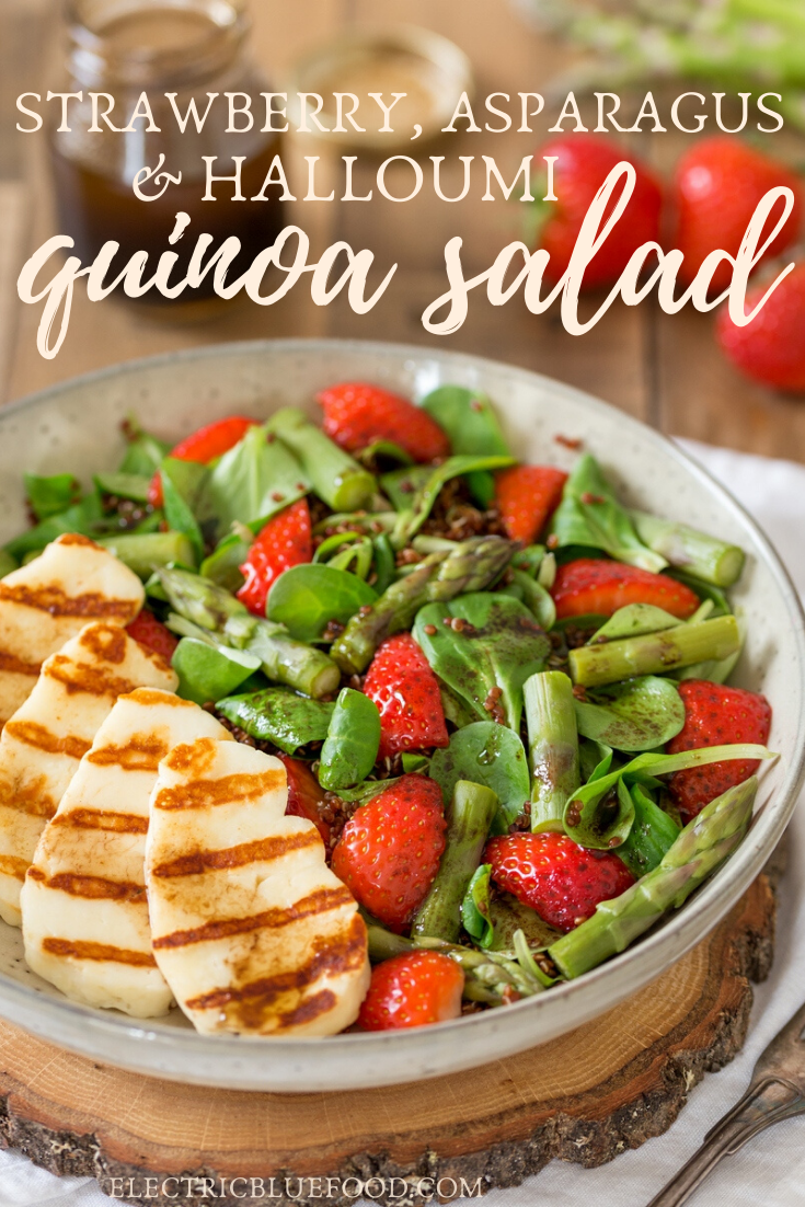 Asparagus and halloumi salad with strawberries and quinoa. A bed of green leaves and red quinoa topped with fresh strawberries, steamed asparagus and grilled halloumi. All seasoned with a simple balsamico vinaigrette. A healthy and balanced summer lunch.