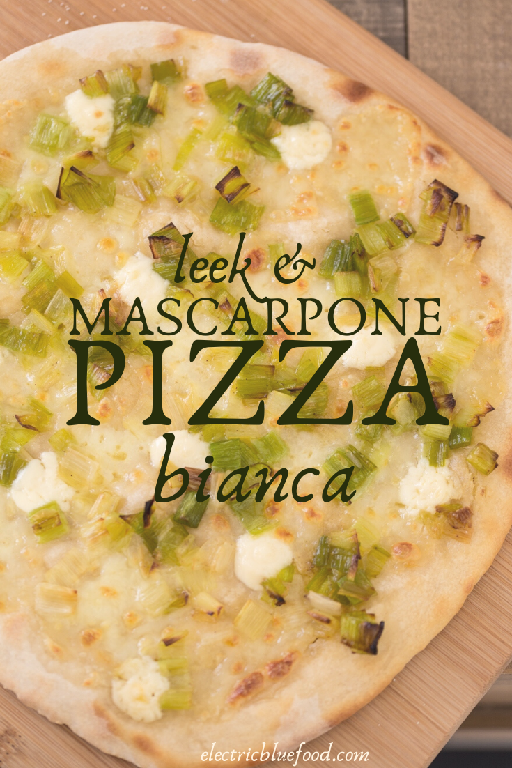 Leek mascarpone pizza bianca: an unusual pizza topping for a delicious homemade pizza. No tomato sauce but good olive oil and puddles of melted mascarpone cheese that perfectly pair with sautéed leeks with white pepper.