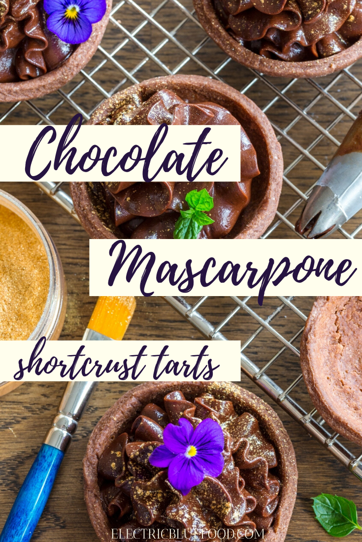 Chocolate mascarpone cream filled small shortcrust shells. Make these delicious chocolate mascarpone tarts and decorate them with edible glitter and flowers.