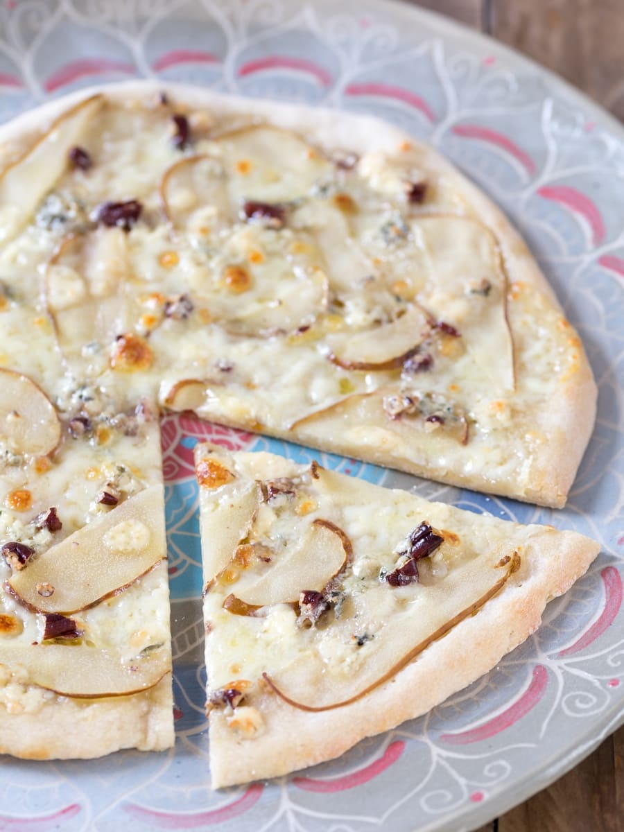 Pear and blue cheese pizza, one slice cut off.