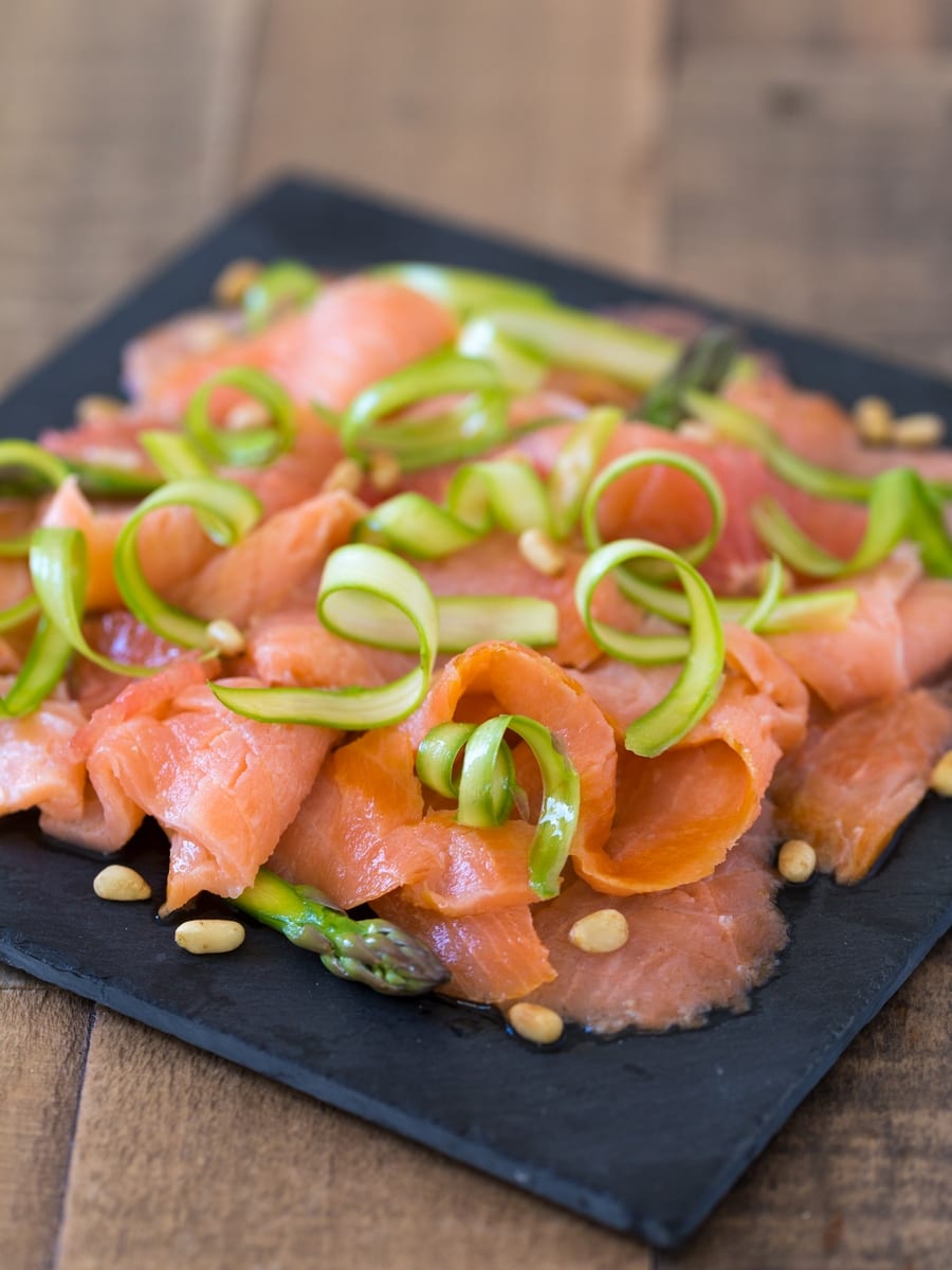 Smoked salmon carpaccio with shaved asparagus and grapefruit.