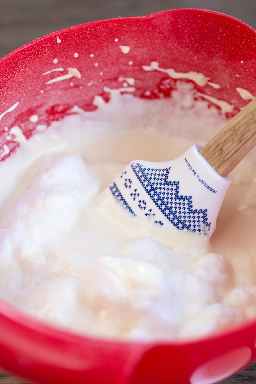Egg whites being folded into sour cream waffle batter.