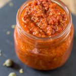 Vegan sun-dried tomato pesto in a jar.