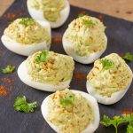 Hard-boiled eggs filled with tuna avocado mayo.