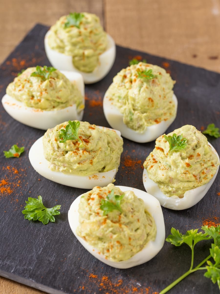 Hard-boiled eggs filled with tuna avocado mayo.