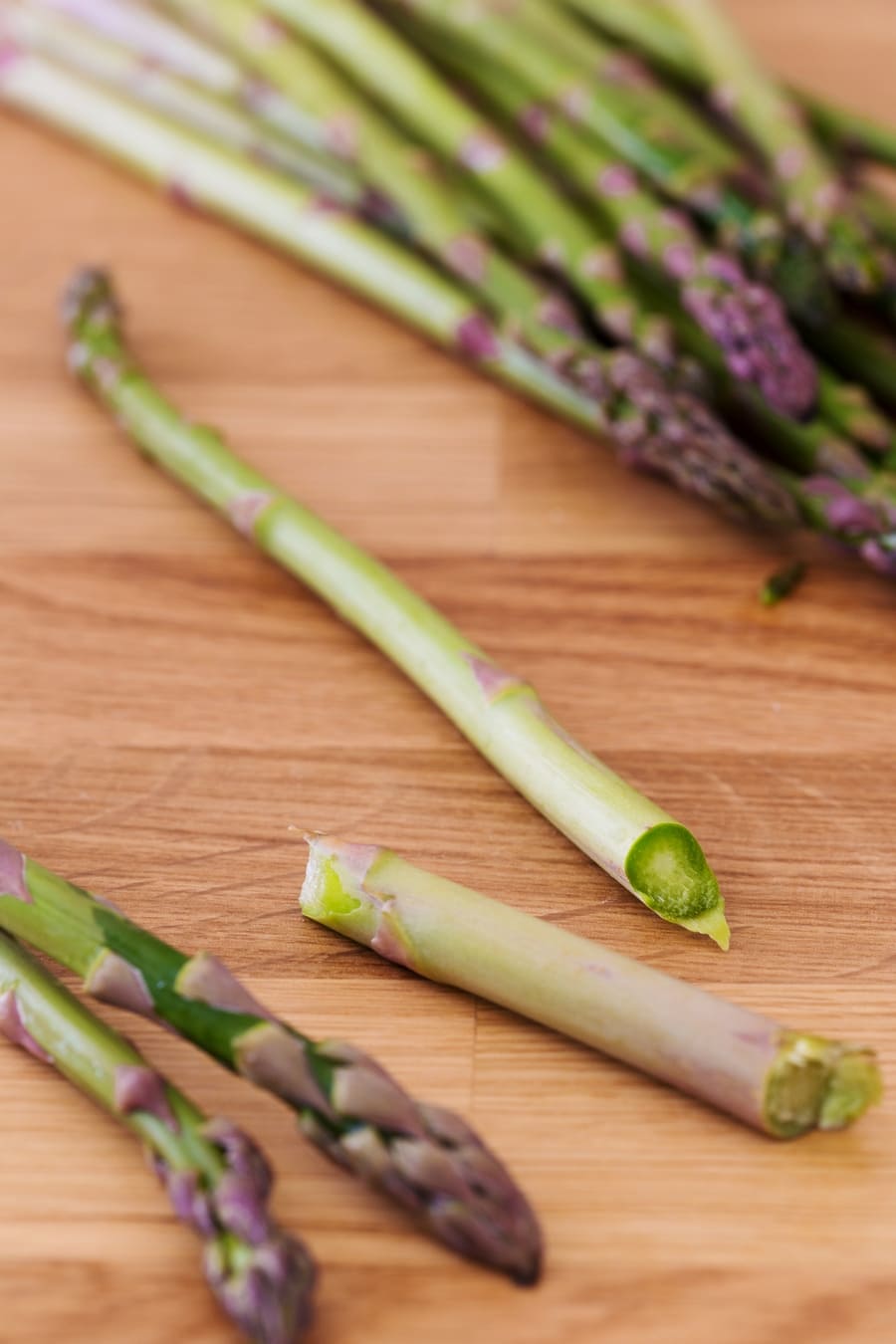 Woody ends being snapped off an asparagus stalk.