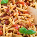 Closeup of tomato pasta with balsamico onion sauce.