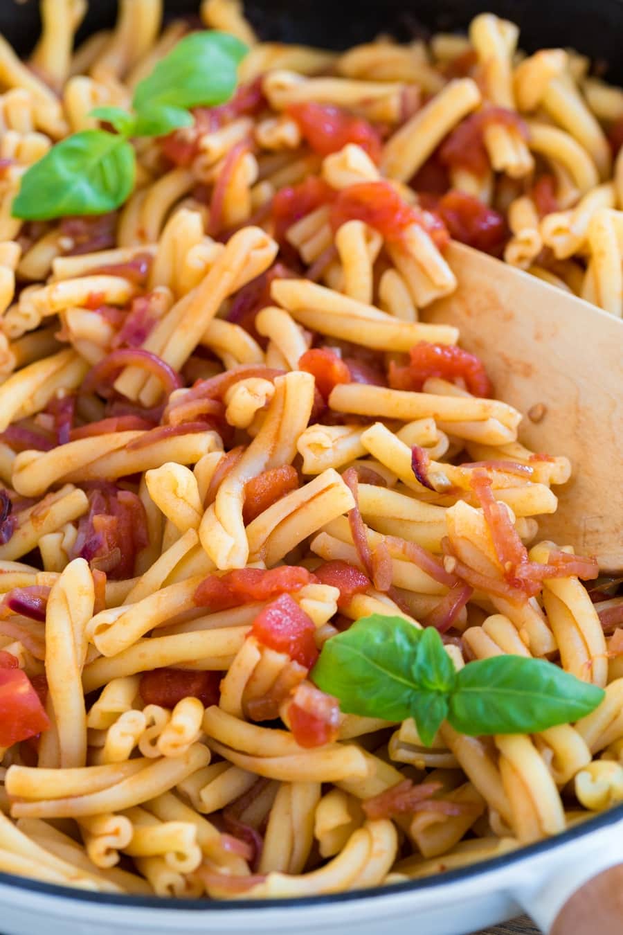 Closeup of tomato pasta with balsamico onion sauce.
