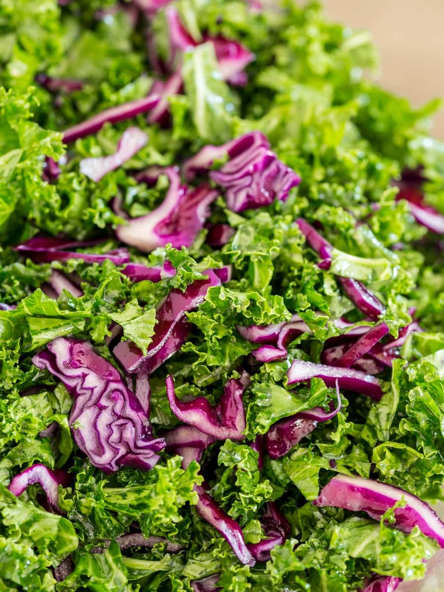 Chopped red cabbage and kale in a bowl.