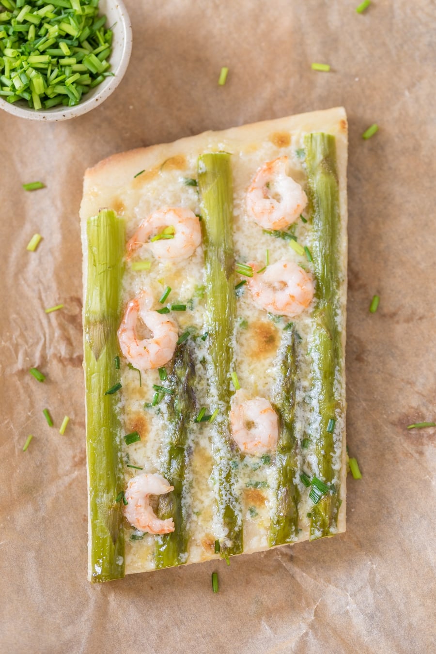 Sliced shrimp asparagus flatbread with zesty mascarpone sauce.