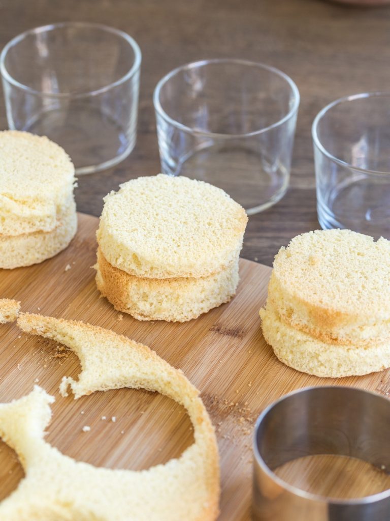 Sponge cake discs cut out from larger form to be used in smaller serving glasses.